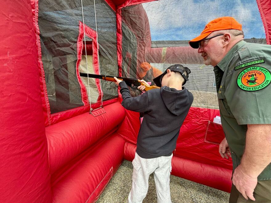 Greyson Girard, 9, gets some practice with an air gun before turkey hunting season starts next month.