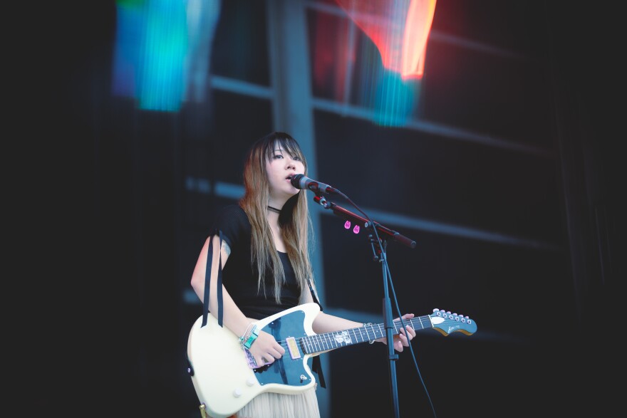 a woman playing guitar 