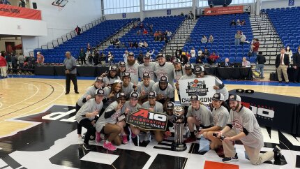The UMass women's basketball team poses in Wilmington, Delaware, after winning the Atlantic 10 tournament on March 6, 2022.