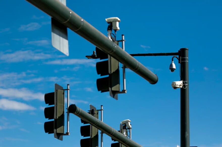 At least four cameras watch over Alameda Avenue at Broadway. Oct. 23, 2025.
