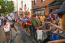 Fans line the street as the Grand Slam Parade passes by.