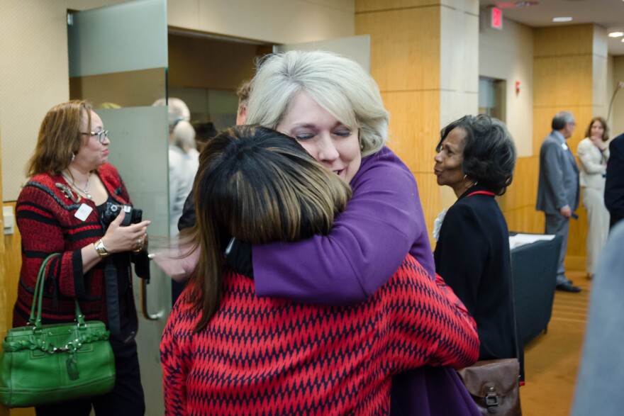 Missouri School Boards' Association Executive Director Melissa Randol hugs St. Louis school board member Donna Jones after the state school board voted Tuesday, April 16, 2019 to return governance of St. Louis Public Schools back to the elected board.