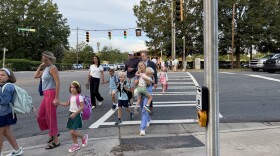 Students and parents walk into Beverly Woods Elementary School on the first day of the 2026-27 school year.