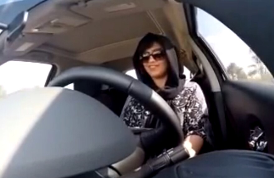 An image made from video released by Saudi activist Loujain al-Hathloul shows her driving toward the Saudi border with the United Arab Emirates before her arrest on Dec. 1, 2014, in Saudi Arabia. She was arrested again last month and remains in detention.