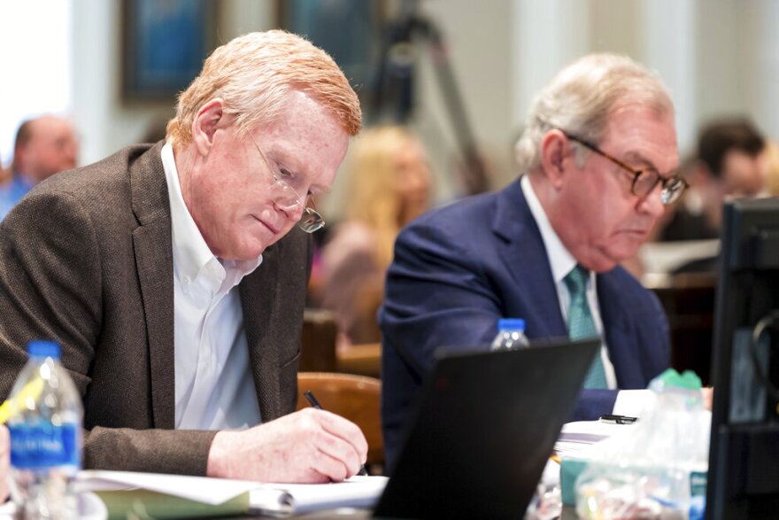 Alex Murdaugh, left, jots down notes during his double murder trial at the Colleton County Courthouse in Walterboro, S.C., on Monday, Feb. 6, 2023. (Jeff Blake/The State via AP, Pool)