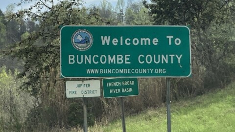 A sign welcomes travelers to Buncombe County.