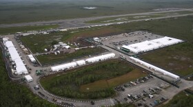 Work progresses on a new migrant detention facility dubbed "Alligator Alcatraz," at Dade-Collier Training and Transition facility in the Florida Everglades, Friday, July 4, 2025, in Ochopee, Fla. (AP Photo/Rebecca Blackwell)