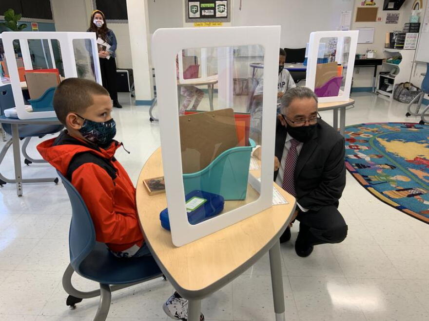 A fourth grader at Dr. Weeks Elementary School with Syracuse Superintendent Jaime Alicea. TOM MAGNARELLI / WRVO PUBLIC MEDIA FILE PHOTO