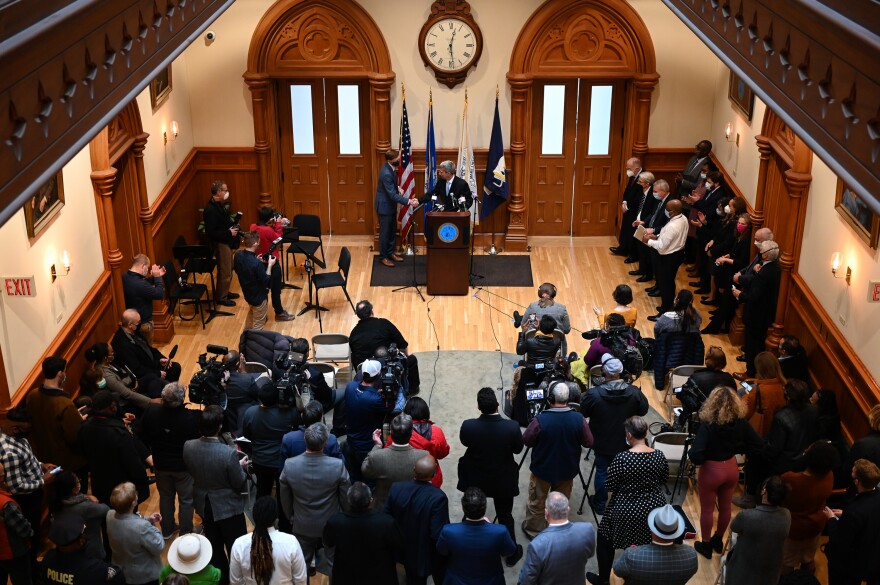 New Haven Mayor Justin Elicker shakes hands with Henry Ferdandez in New Haven City Hall. Fernandez was the lead negotiator in a deal between Yale University and the city of the New Haven that will increase the school’s voluntary payments to the city by $52 million over the next 6 years.