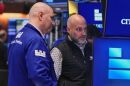 Specialists Philip Finale, left, and Meric Greenbaum work on the floor of the New York Stock Exchange, Friday, May 29, 2026. (AP Photo/Richard Drew)