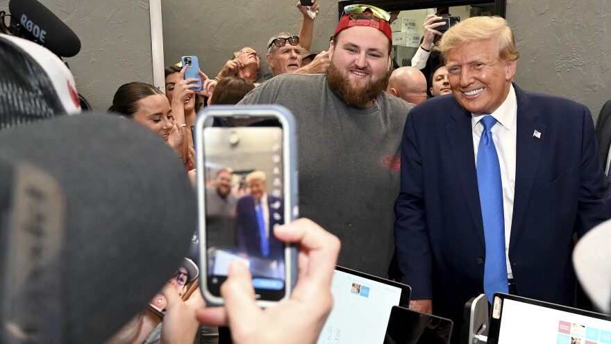 Former President Donald Trump stopping by Downtown House of Pizza in Fort Myers, Fla., where employees of the establishment greeted him and took photos.