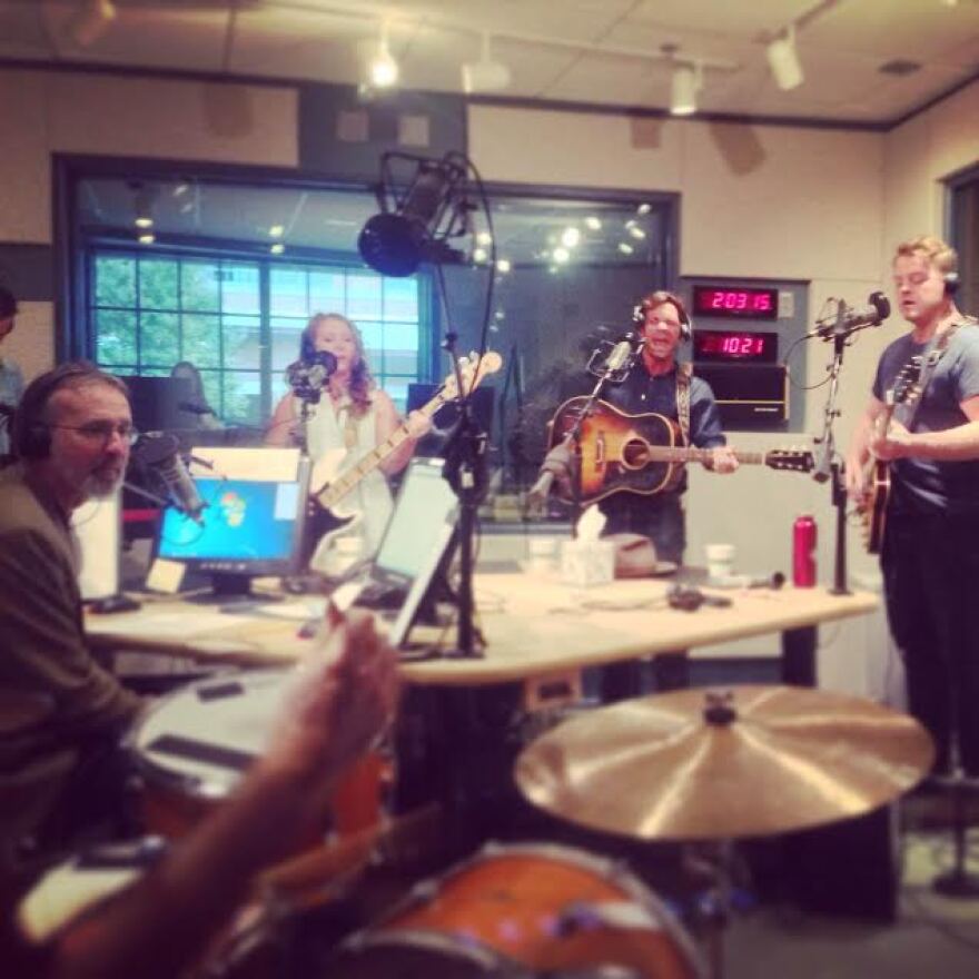 The Lone Bellow performing in the WUNC Studios with Frank Stasio listening.