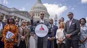 House Minority Leader Hakeem Jeffries, D-N.Y., center, and members of the Congressional Black Caucus speak outside the Capitol in Washington, Tuesday, May 19, 2026.