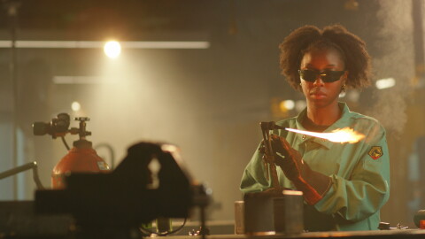 Multiple Choice black woman holds a acetylene gas cutting torch