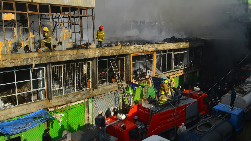 Afghan firefighters battle a 2010 market fire, which destroyed hundreds of shops. The city is bone-dry much of the year, making it a giant tinderbox.