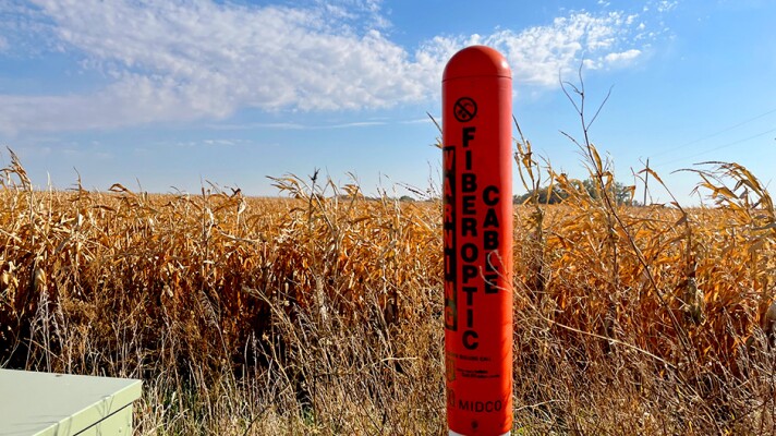 An orange post indicates the presence of fiber optic cables.