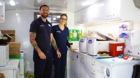 Representatives from the Global Alzheimer’s Platform Foundation prepare the mobile unit for cognitive assessments and blood testing on Friday, Sept. 25, 2026. (Catherine Chapman/WUFT News)