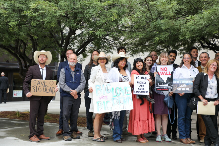 Anti-wall advocates and plantiffs gather for a group photo outside of a federal courthouse in El Paso on Friday, October 2.