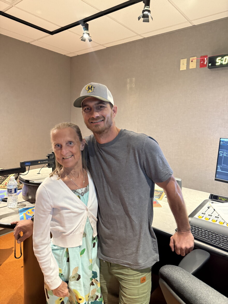 Former Lincoln Avenue School teacher Amy Domagowski and alumnus Todd Gross are smiling for a picture.