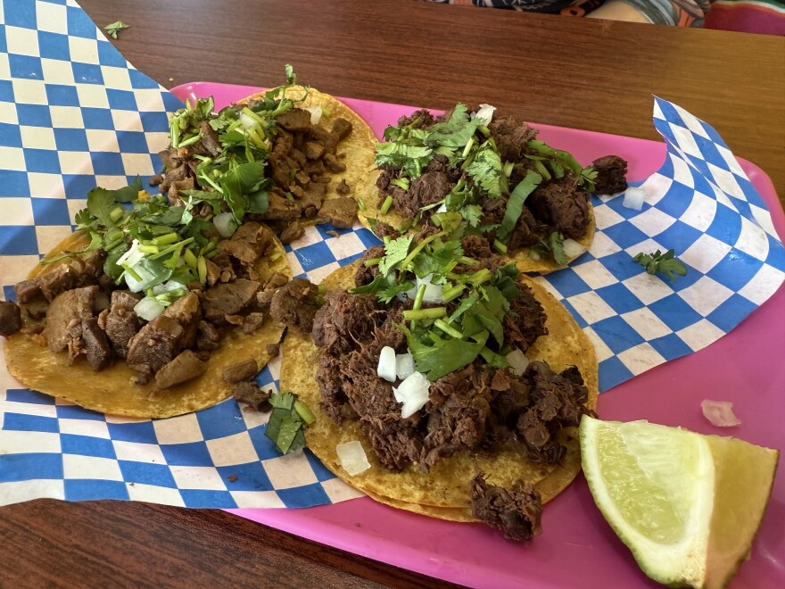 Carne asada mini tacos on the left and jackfruit barbacoa on the right