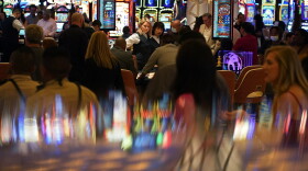 In this June 24, 2021 photo, visitors crowd the casino during the opening night of the Resorts World Las Vegas hotel-casino in Las Vegas.