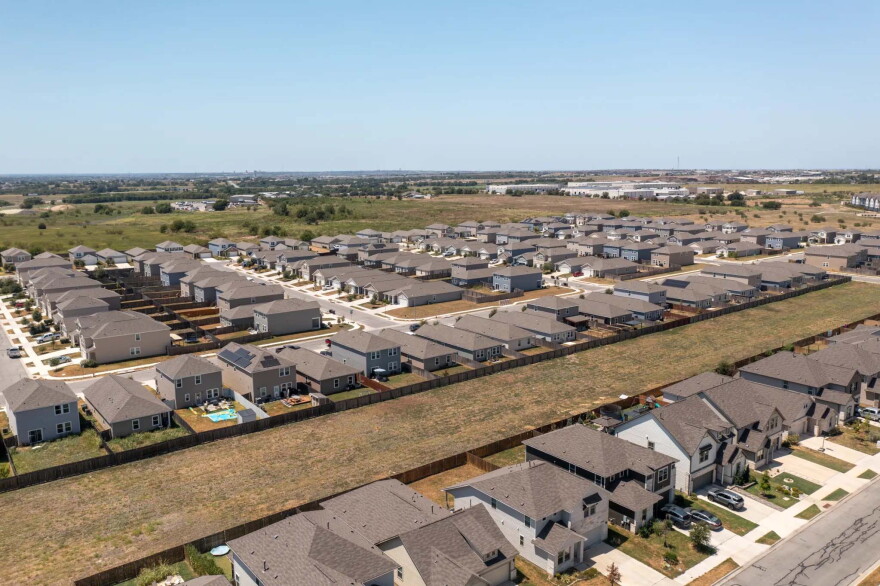 Sherrie Daugherty, who is struggling with high summer electricity bills, lives in this new Hutto neighborhood that lacks shade. Experts on affordable energy say trees can improve energy efficiency, reduce cooling costs, and increase overall comfort.