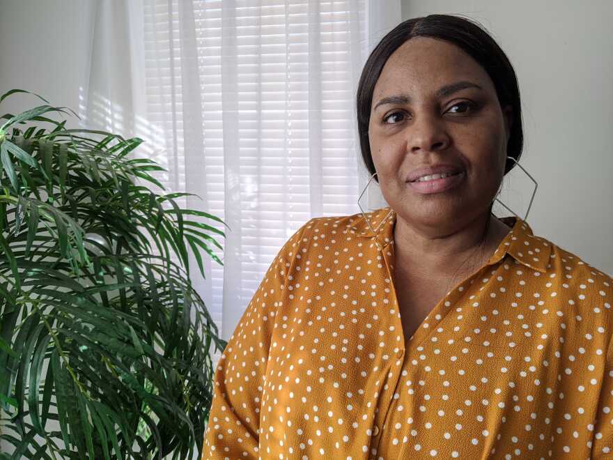 Rosalyn Chambers stands in her living room.