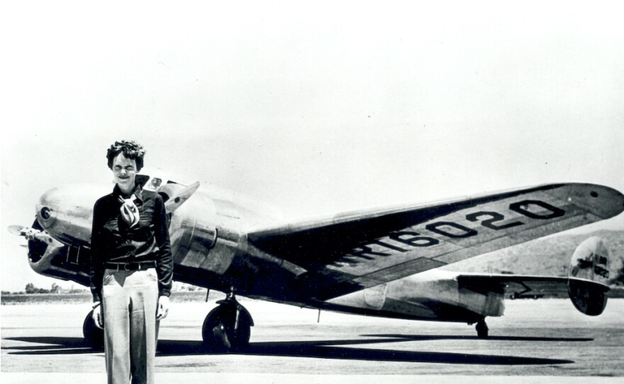 Amelia Earhart with a Lockheed Electra 10-E, the plane she was flying when she disappeared in 1937.