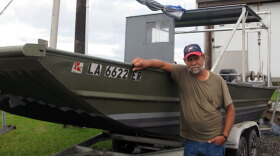 Al Cassagne, who lives just outside of Grand Isle, La., has been fishing the local waters for more than 32 years. He is standing next to one of three commercial fishing boats he operated until the oil spill closed off the fishing waters.