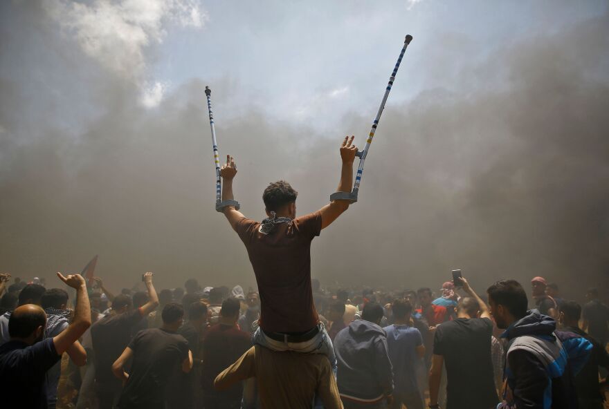 Palestinians protest near the border between Israel and the Gaza Strip.