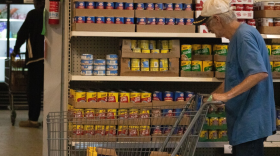 Visitors of God's Food Bank in Guthrie push their carts in the self-serve pantry.