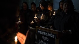 LaDonna Horne, center, is surrounded by family and friends during a vigil honoring her son, DaShawn Horne, on Saturday, Feb. 3, 2018, at Harborview Park in Seattle. 