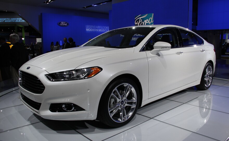 A white sporty car at the Detroit Auto show