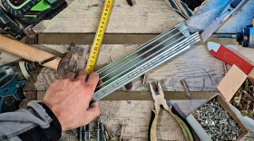 Tools and materials for installing plasterboard suspended ceiling.