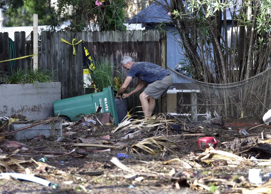 A Cedar Key, Florida, business owner clears debris outside his office after Hurricane Hermine. The hurricane was downgraded to a tropical storm after it made landfall in Florida and, now off the Northeast coast, is expected to weaken. (AP Photo/John Raoux)