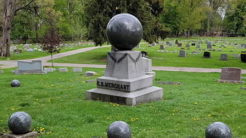Several graves are shown inside a cemetery.