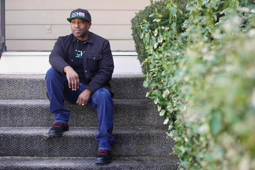 Lenny Berry sits outside a building in Parma that he hopes to open as a marijuana dispensary later this year.