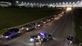 Traffic creeps out of the infield about 1 a.m. 7/10/11 after the inaugural NASCAR Sprint Cup Series Quaker State 400 at Kentucky Speedway, Sparta. The race ended about 11 p.m. All vehicles must exit the infield through a single tunnel.