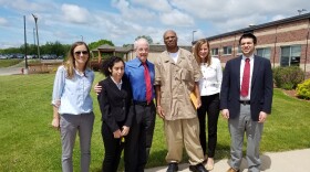 Desmond Ricks and members of the Michigan Innocence Clinic pose outside the prison where Ricks had been held since 1992