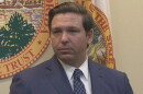 close up image of man in a gray suit looking to his left