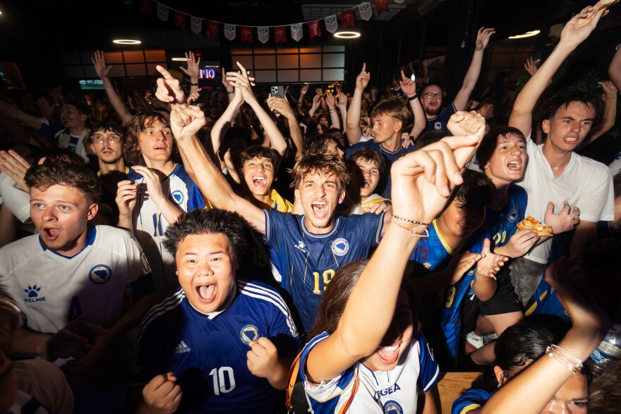 St. Louis Bosnians and community members root on the Dragons during a watch party for Bosnia's FIFA World Cup knockout match against the United States on Wednesday at Bevo Caffe Lounge in St. Louis' Bevo neighborhood.