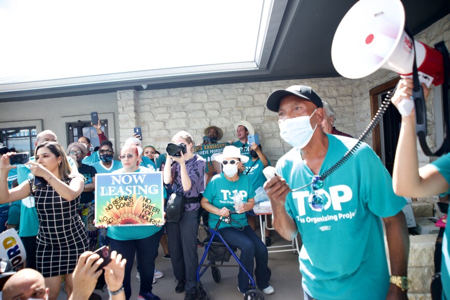 Protesters rally outside of Achieve Properties headquarters in Austin, Texas on August 1, 2022.