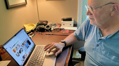Skip Shea, 66, sits at his desk in Uxbridge, Massachusetts. Shea, a survivor of child sexual abuse at the Worcester Diocese, has asked the Massachusetts attorney general's office to release its investigation into three Catholic dioceses in the state.