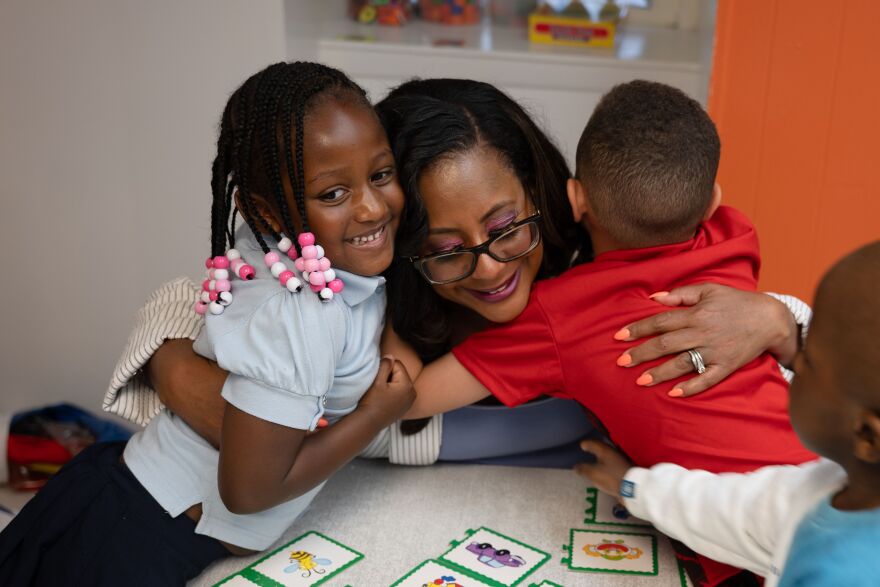 NJ Assemblywoman Verlina Reynolds-Jackson shares a hug with kids at Newark Day Center