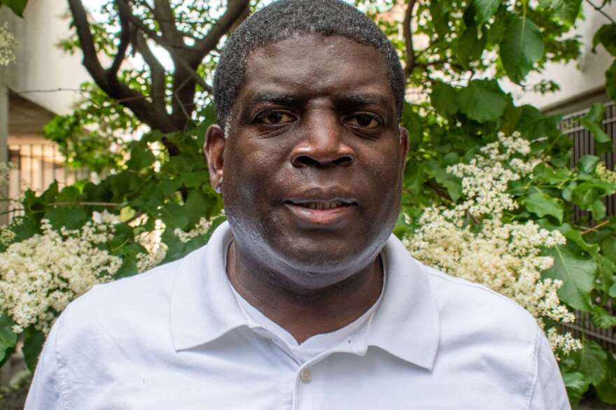 Vince Felder stands outside the Connections studio at WXXI.