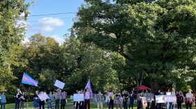 People rally at Tacoma's Wright Park to call for Mary Bridge Children's Hospital to reverse its decision to not offer any new gender-affirming care to pediatric patients.