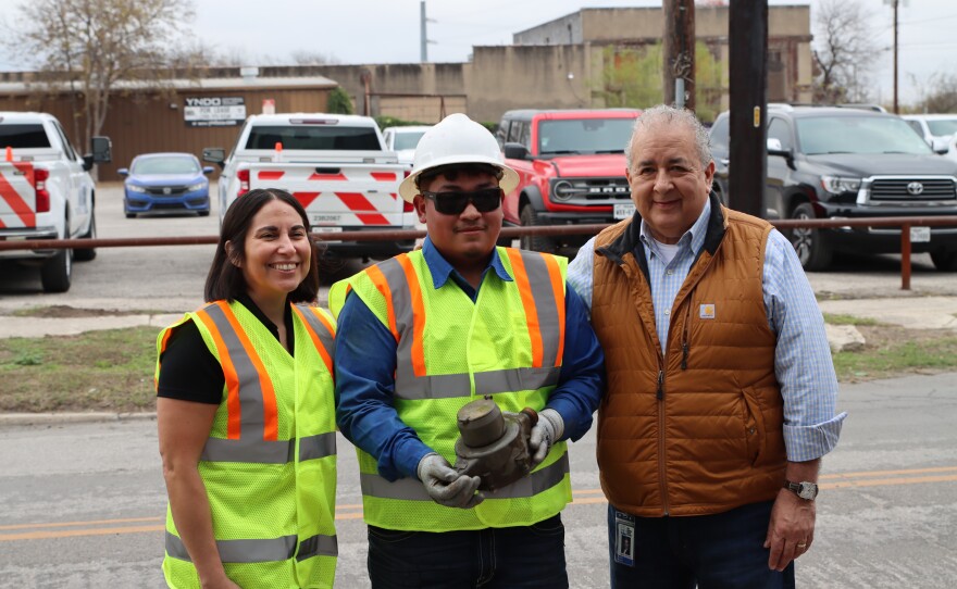 Members from the San Antonio Water System complete the installation of the final Connect H20 electronic meter on Carolina St. From left to right: Cecilia Velasquez, Vice President of Customer Experience & Strategic Initiatives; Foreperson Octavio Carrizales — he installed the final meter; SAWS President & CEO, Robert Puente.
