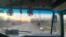 A Rockford Public Schools bus drives through the city picking up students late in 2021.