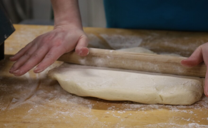 Caitlyn Wallace rolling out pie dough. Photo by Allison Diaz.