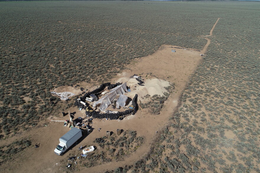 FILE - An aerial view of a makeshift compound is seen in the desert area of Amalia, N.M., Aug. 10, 2018.